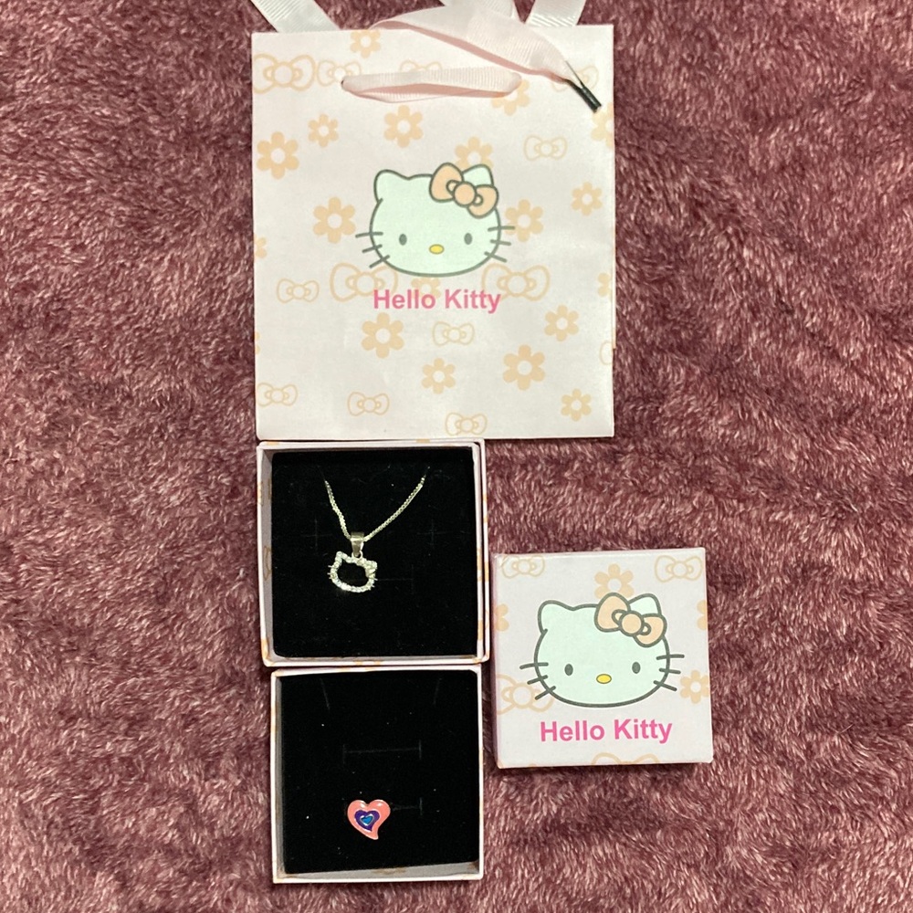 Hello Kitty Silver Pendant with Necklace. Bags & Boxes.